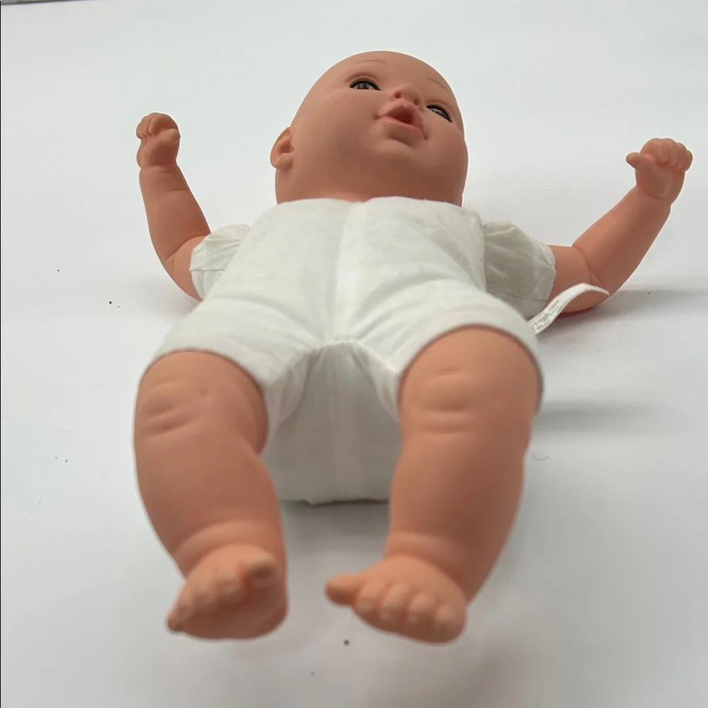 Realistic Baby Doll with White Outfit